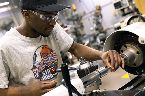 A student works on a machine tool machine