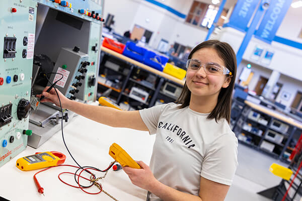 Electro-Mech student works in the lab