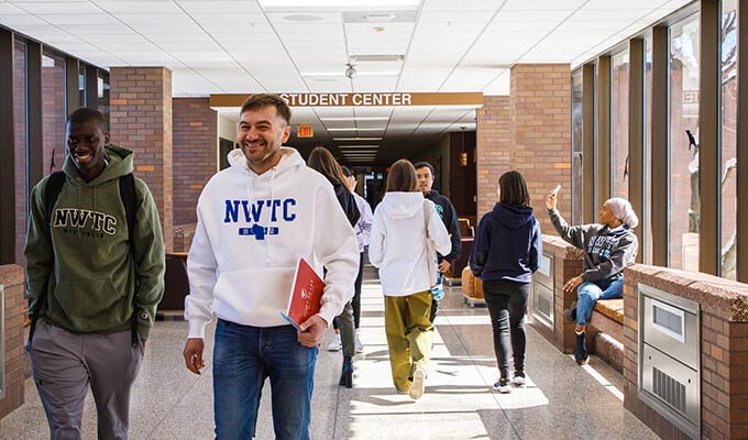 Students walk down hallway