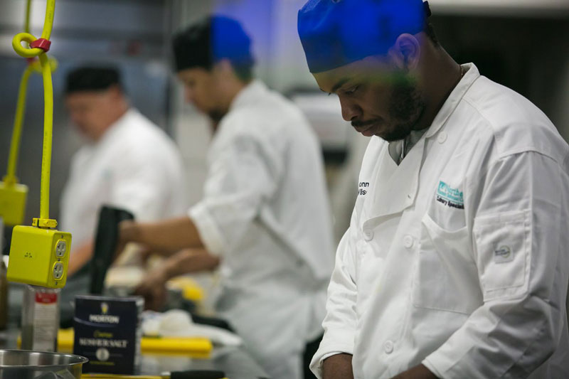 Culinary students work side by side in the culinary lab