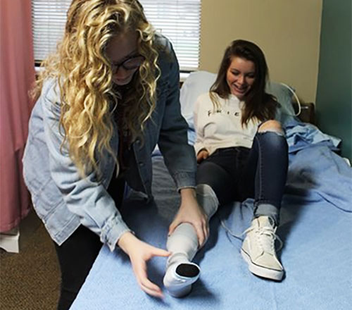 Ashwaubenon student with a patient