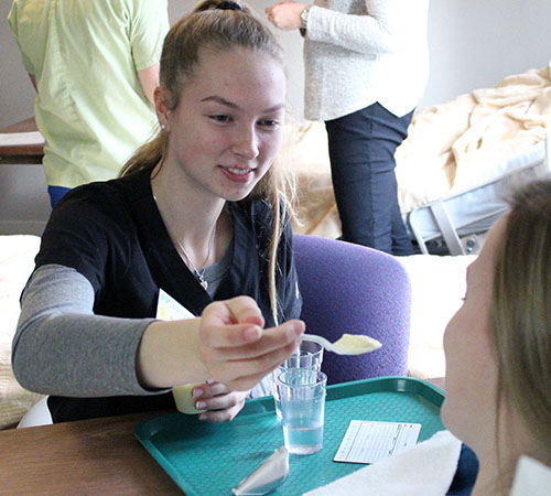 Door country student feeds a real patient