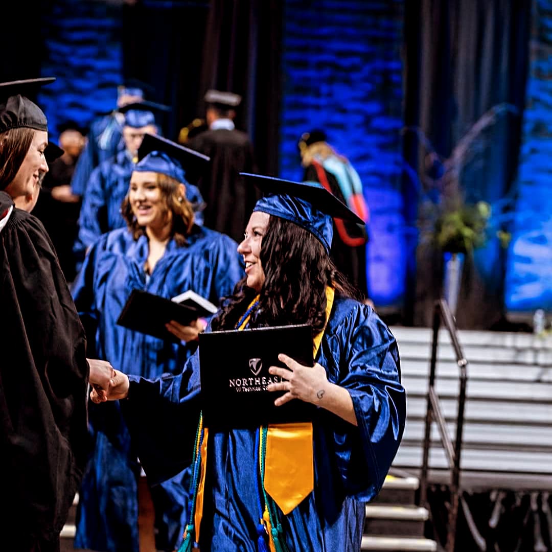 Melinda Gregurich walking at graduation. 