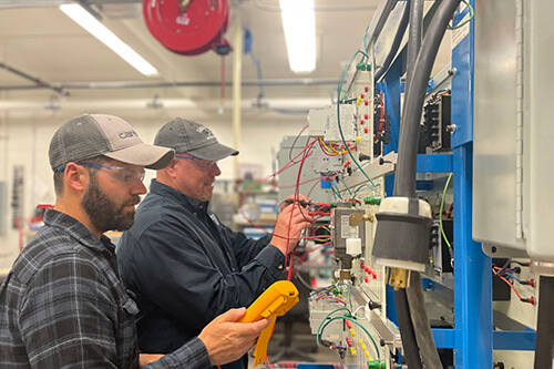 Workers learn advanced marine manufacturing techniques at the North Coast Marine Manufacturing Training Center