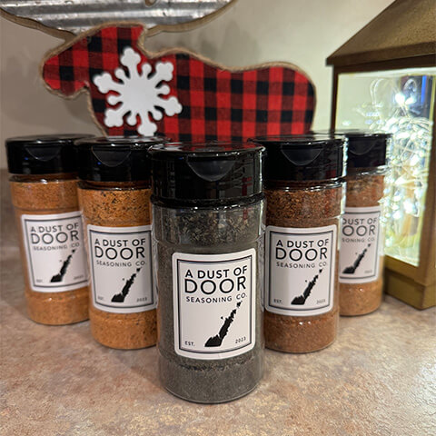 Seasonings from Dust of Door aligned in a row with home decor items