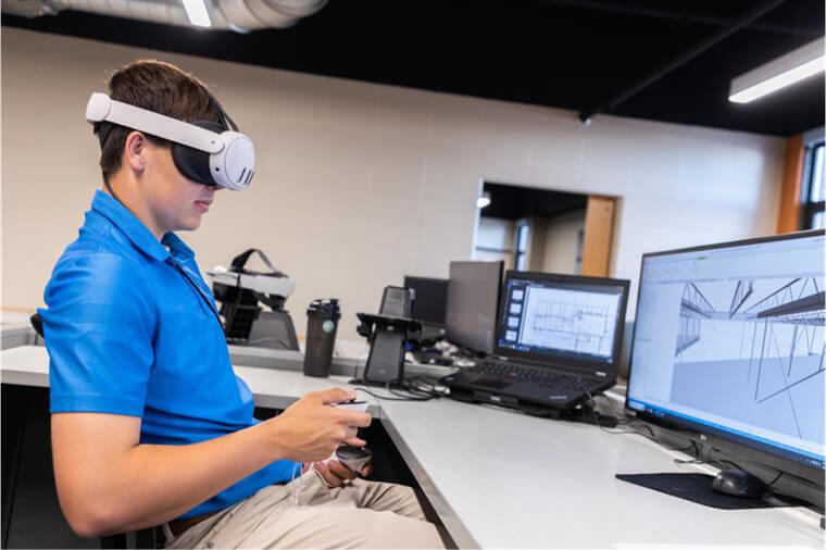 Student using AR/VR headset works with instructor