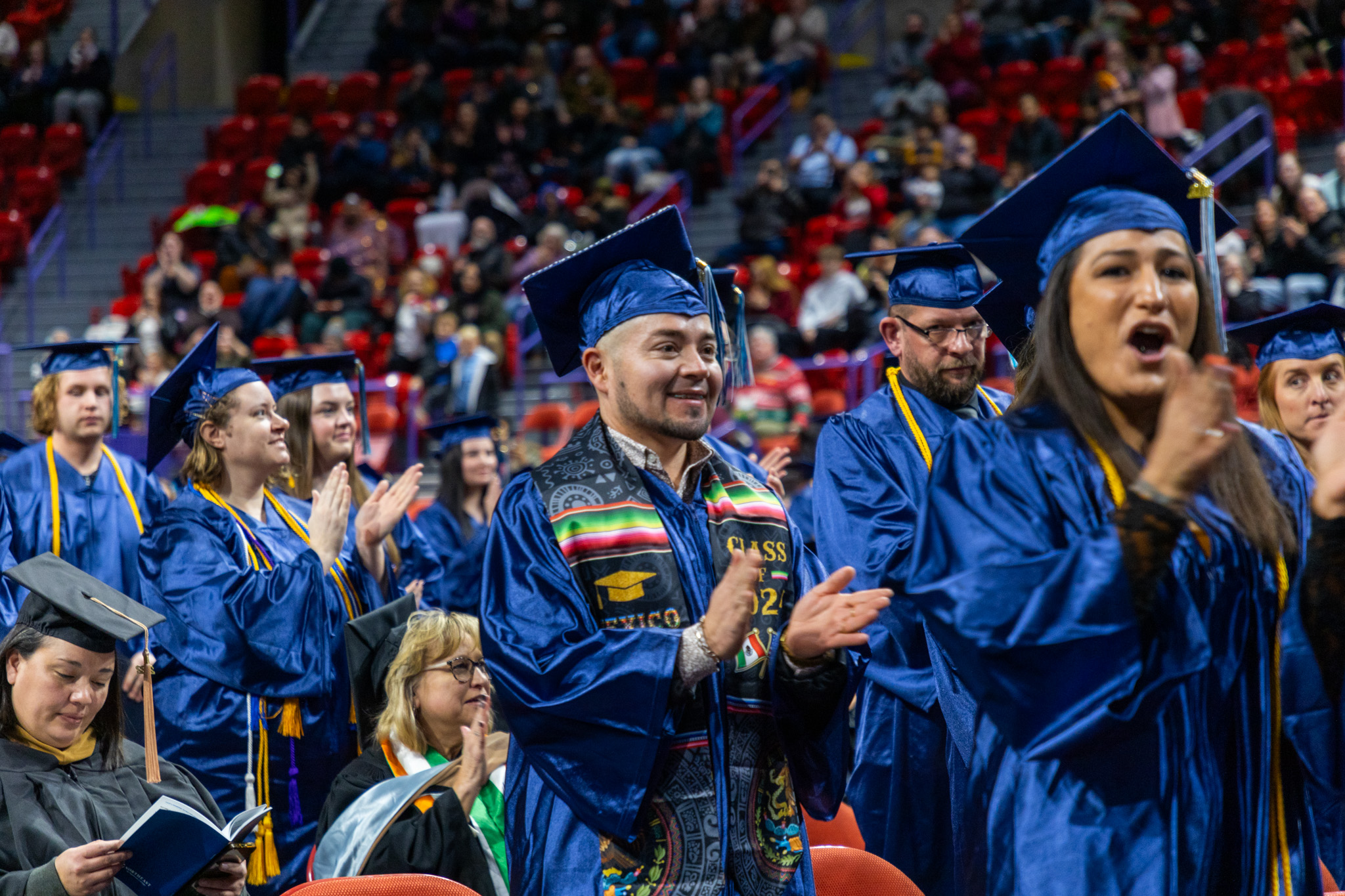 NWTC Graduates pose with the eagle after the ceremony