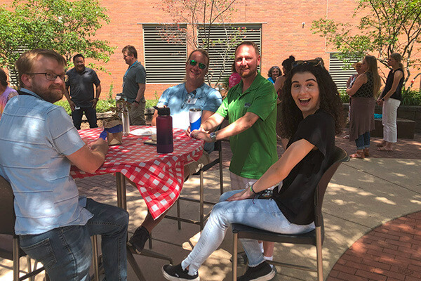 Employees have a picnic on the patio