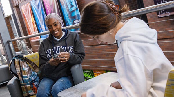 Instructor talks to student using VR headset