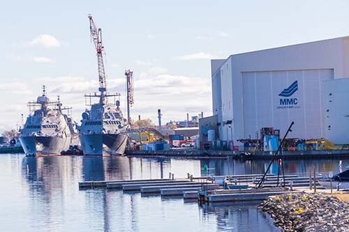 Ships n te harbor with cranes at the North Coast Marine Manufacturing Training Center